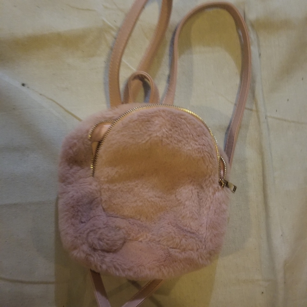 Pink fluffy Olivia Miller backpack
